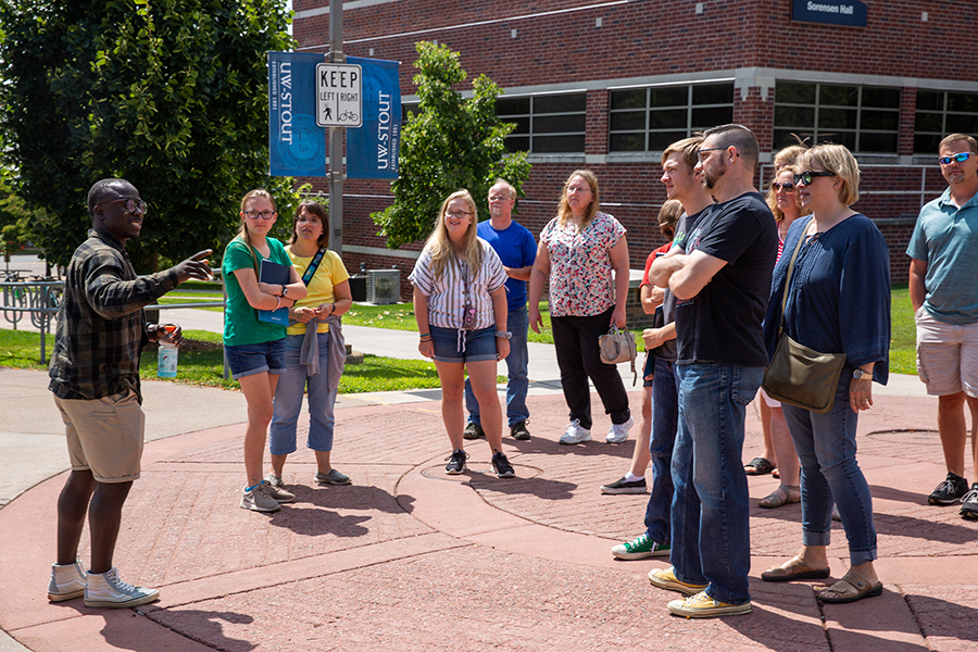 Student Arthur Roques leads a campus tour recently for prospective students.