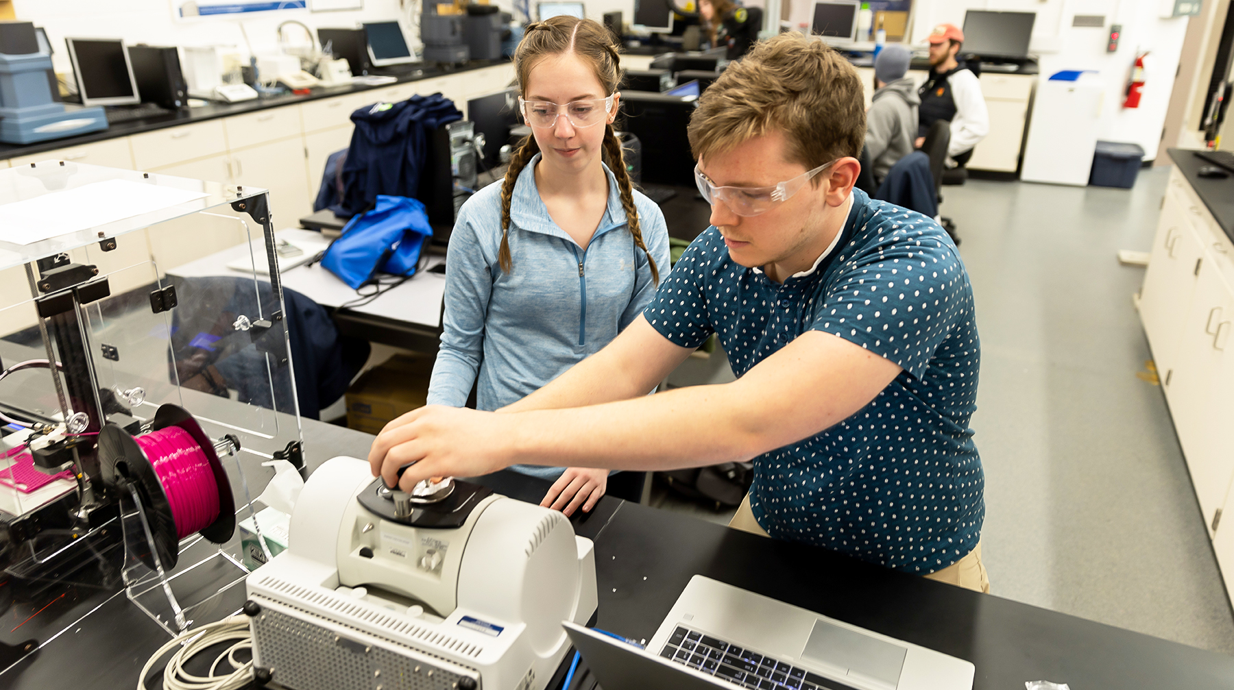 Students utilize equipment in the plastics analysis section at UW-Stout.