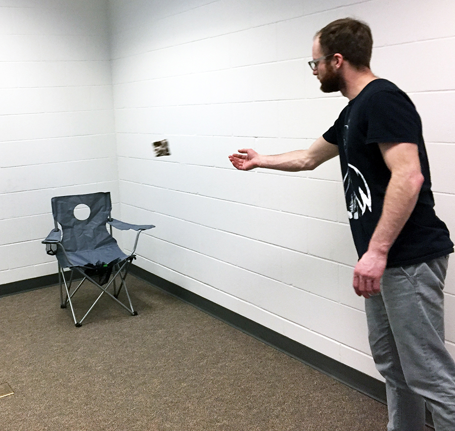 UW-Stout student Reid Geiger demonstrates how to play the patent-pending PlaySit game that he and Emily Doroff are presenting at the Wisconsin Big Idea Tournament in Madison.