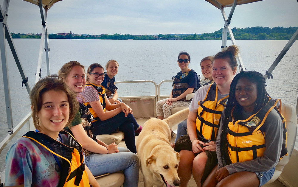 LAKES REU students take a pontoon ride on Lake Menomin to learn more about the lake and blue-green algae.