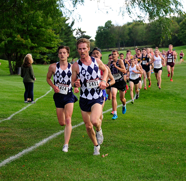 Mike Friedman leads a pack of runners during a cross country meet. Friedman will be a senior this fall.