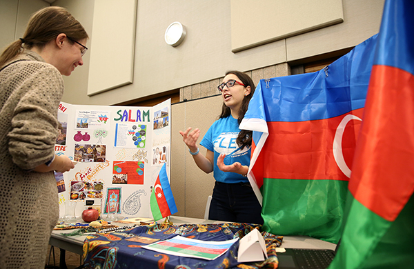 ​​​​​​​A student talks about her country during the international exhibits in 2018.