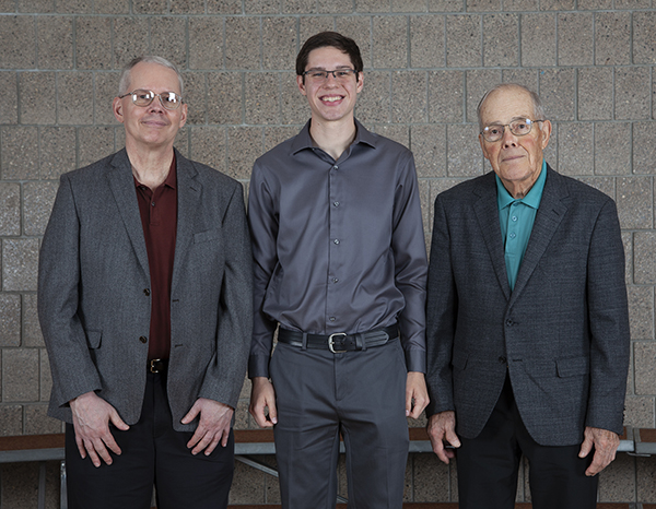 The first UW-Stout Landsverk Endowed Family Scholarship was awarded in fall 2019 to student Chase Heim, center. Don Landsverk, right, and his wife, Donna, started the scholarship with their family, including son David, left, a UW-Stout alumnus.