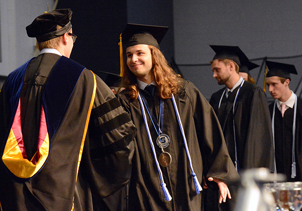 Lucas Morgan receives his diploma May 4.