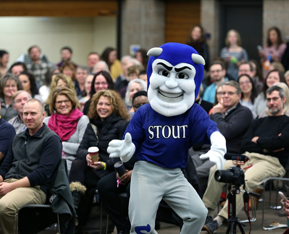 Blaze, the UW-Stout mascot, dances during a surprise visit to the program. 