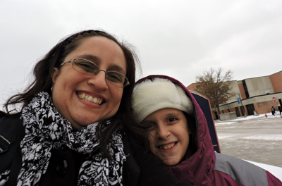 With her daughter, Anisa, 9, Veronica Solano visits campus in December for commencement. It was the first time Anisa experienced snow.