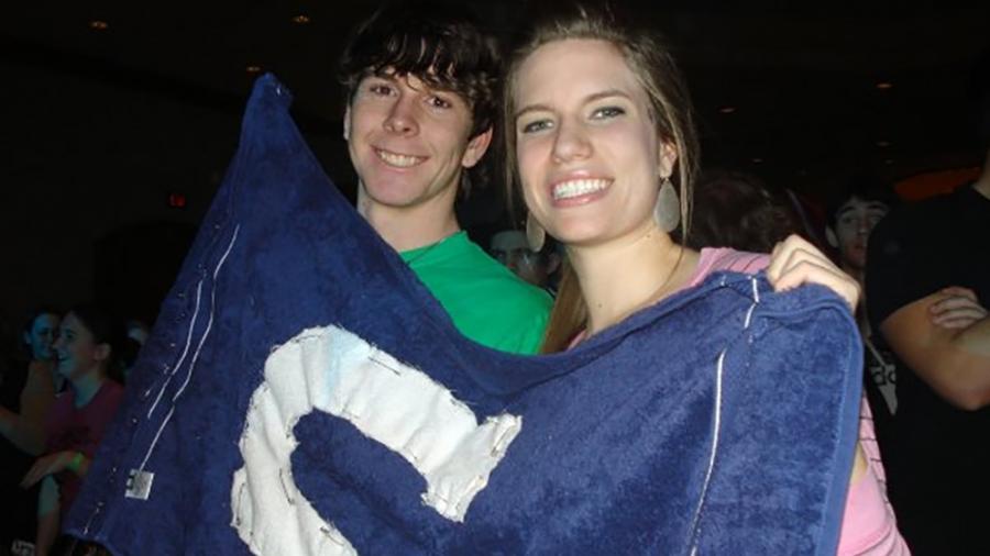 Students Keegan Hastreiter and Karlah Hahn hold at UW-Stout flag during a Campus Crusade for Christ event in December 2010 at UW-Stout.