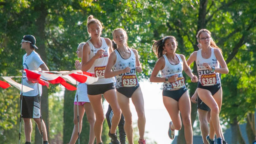 UW-Stout women’s cross country team members compete in a fall 2021 meet.