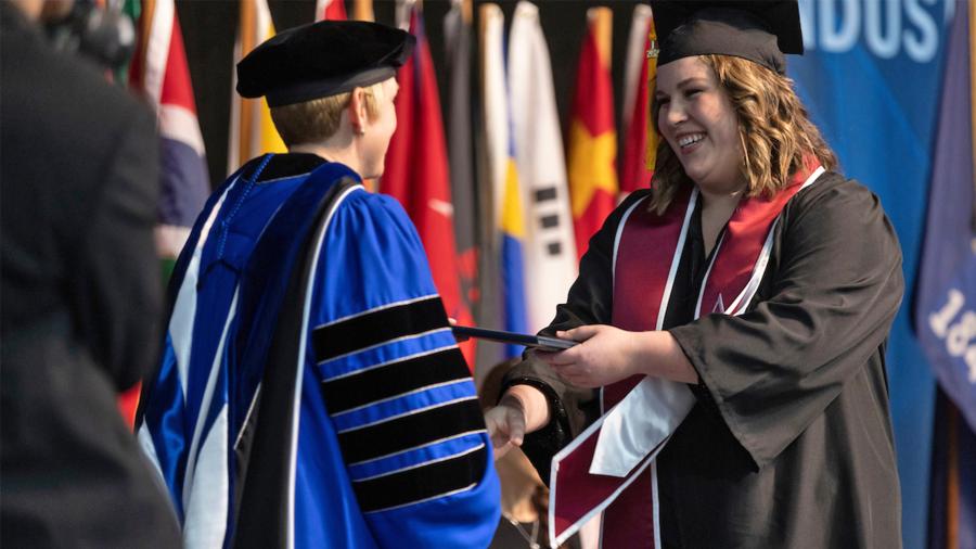 Sarah Webber crosses the stage at commencement on Dec. 17.