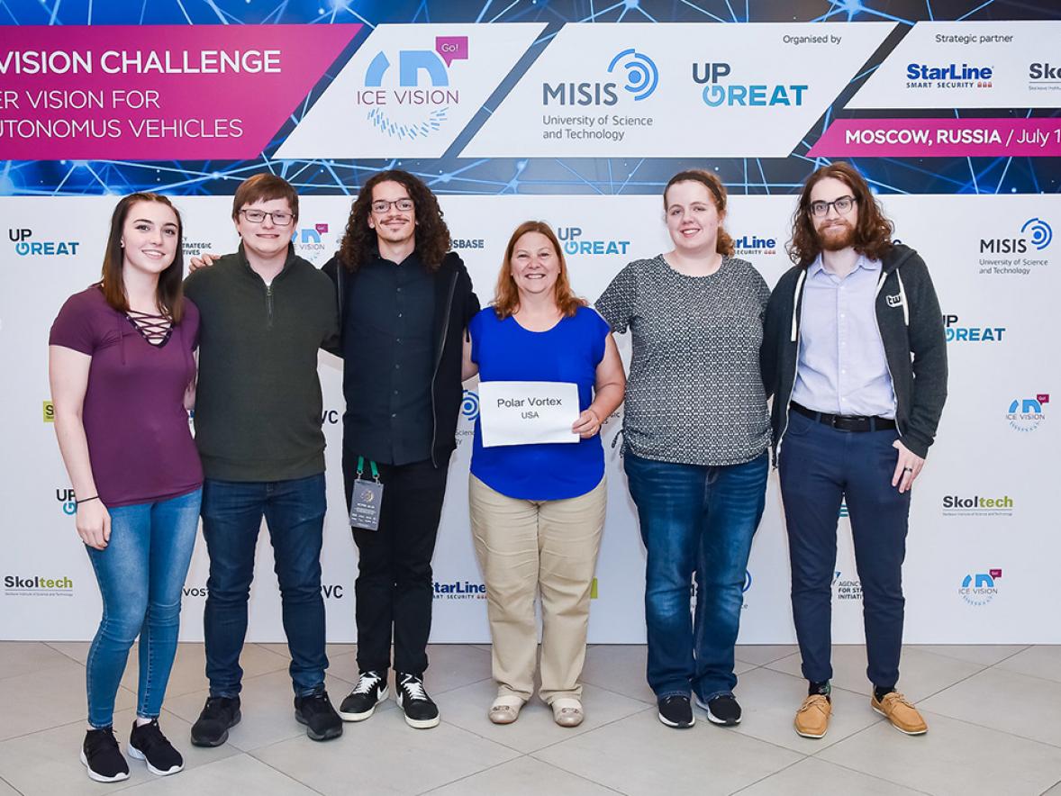 UW-Stout Ice Vision Hackathon team student members Megan Southwick, at left, Kyle Lunde, Jonathon Terry, Professor Diane Christie, Christina Miller and Simon Meyer pose for a picture at the competition held in Moscow. The team won a best presentation award. / Photos courtesy of MiSiS