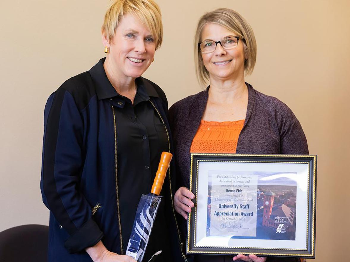 Renee Eide, right, receives the September University Staff Employee Appreciation Award from Chancellor Katherine Frank.