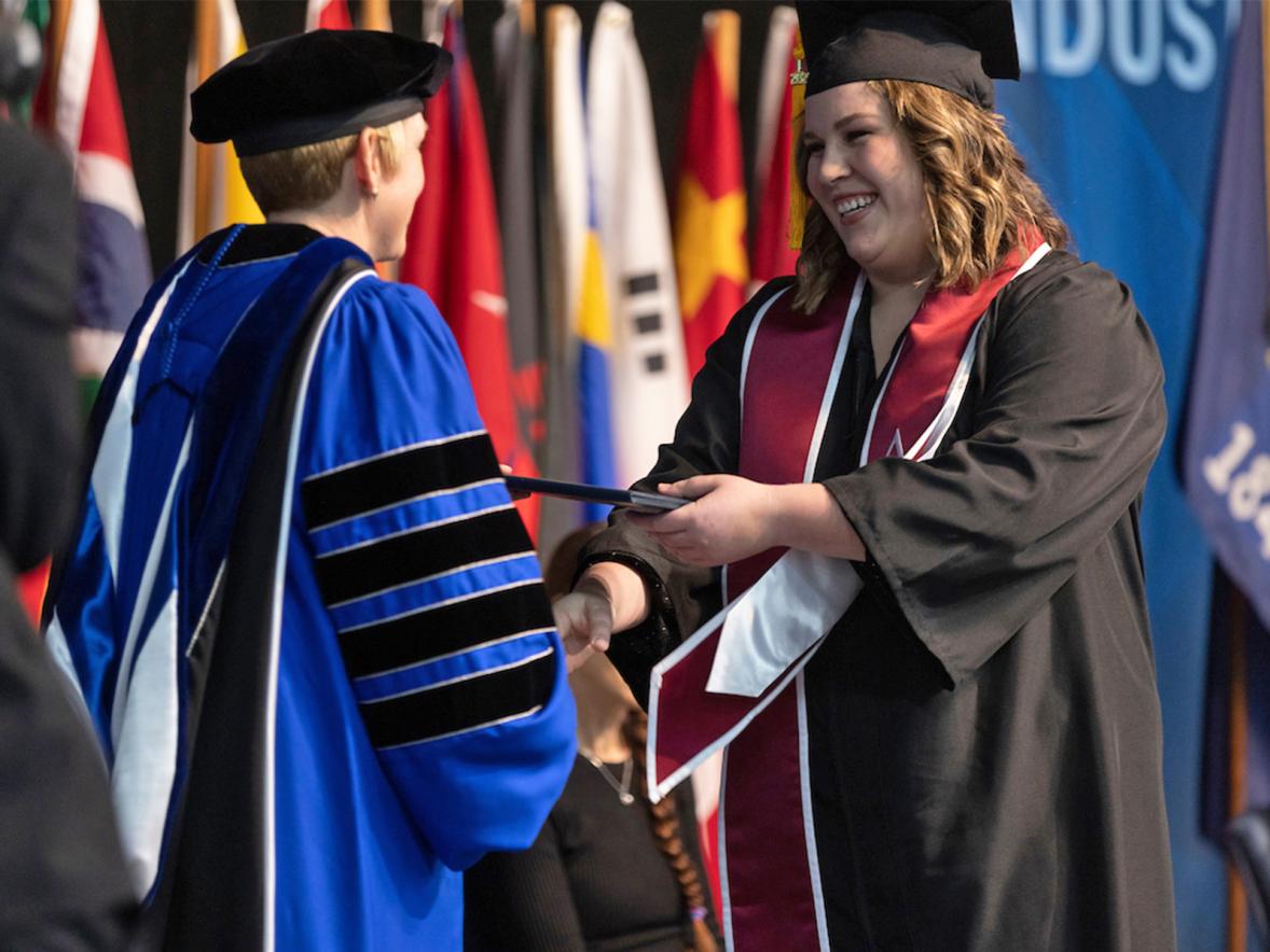 Sarah Webber crosses the stage at commencement on Dec. 17.