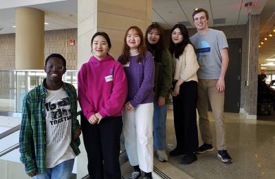 Winter in the Midwest peer mentors Vaughn Hess and Jake Thomas with mentees Yooneso Pae, Minji Chung, Hyunah Moon and Yujeong Shin. Pictured in the MSC stairwell.